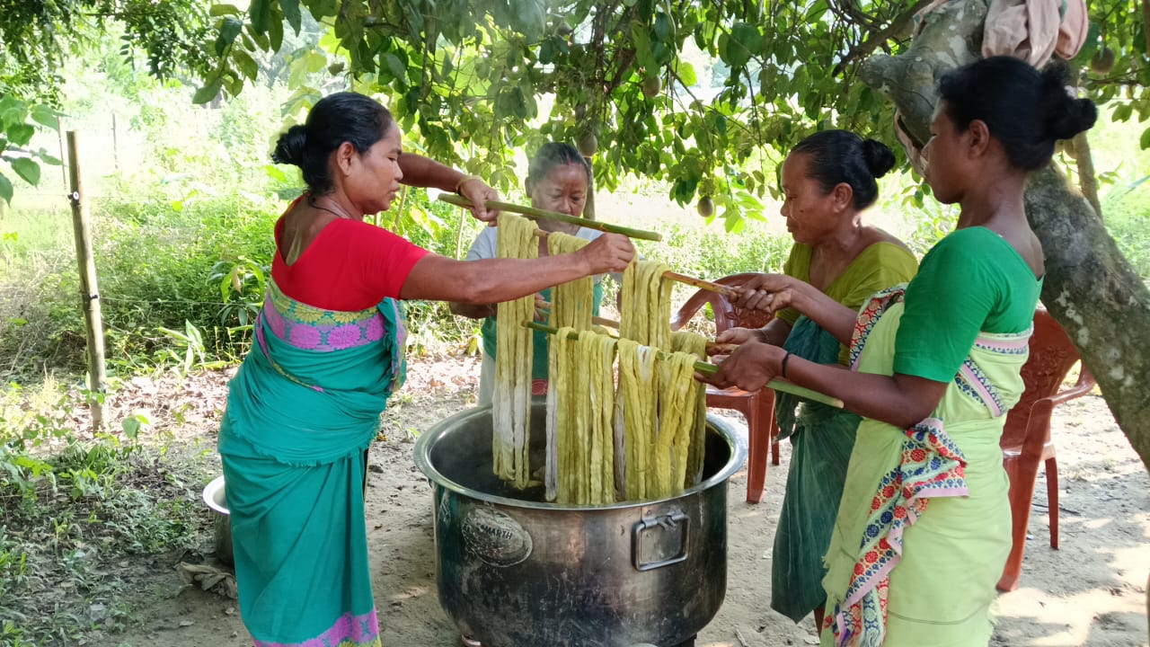 Women preparing botanical dye baths
